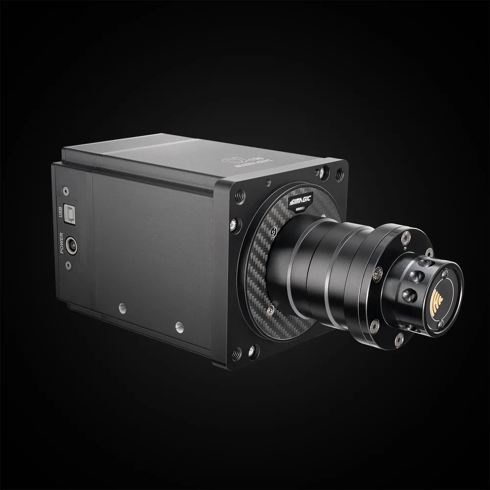 Simagic Alpha Mini direct-drive wheel base, three-quarter view of the black aluminum housing with a carbon-fiber front plate, the quick-release shaft, and the USB and power sockets on the left flank